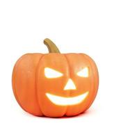 Halloween pumpkin with scary glowing face isolated on white background photo