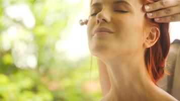 Beautiful caucasian woman getting head massage at spa. photo