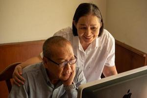 Asian woman supporting businessman at the office room. photo