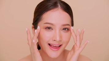 Beautiful face of Asian young woman with natural skin. Portrait of attractive girl with soft makeup and perfectly beautiful skin. photo