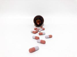 Medicine Pills or Tablets Drop and Out of the White Plastic Bottle. photo