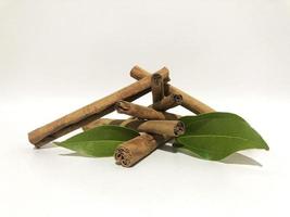 Fragrant cinnamon sticks on a white background photo