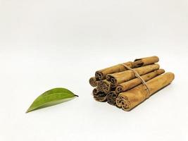 Fragrant cinnamon sticks on a white background photo