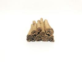 Fragrant cinnamon sticks on a white background photo