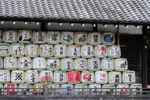 Five rows of stacked sake casks photo