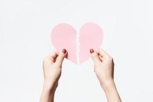 Close up women holding pink blank paper on white background Premium Photo