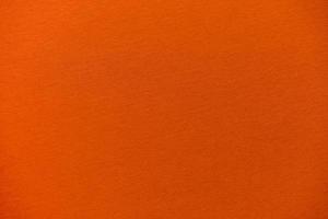 Orange paperboard surface texture background photo