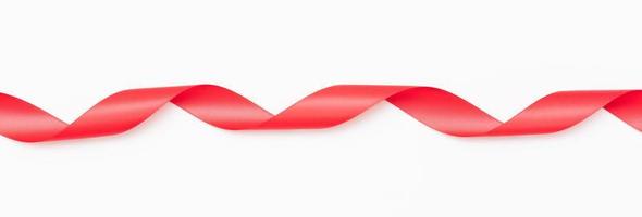 Curly red ribbons on white background photo