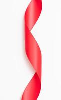 Curly red ribbons on white background photo