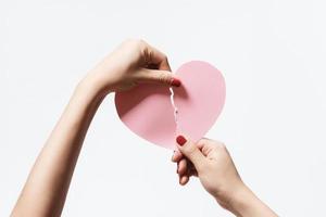 Close up women holding pink blank paper on white background Premium Photo