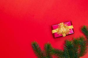 Christmas background concept. Top view of Christmas gift box gold balls with spruce branches photo