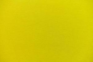 fondo de textura de superficie de cartón amarillo foto