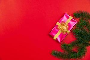 Christmas background concept. Top view of Christmas gift box gold balls with spruce branches photo