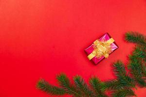 Christmas background concept. Top view of Christmas gift box gold balls with spruce branches photo