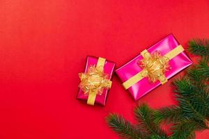 Christmas background concept. Top view of Christmas gift box gold balls with spruce branches photo