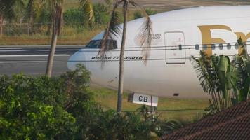 PHUKET, THAILAND DECEMBER 1, 2018 - Emirates Boeing 777 A6 ECB taxiing after landing at Phuket International airport video