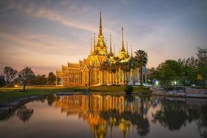 Beautiful temple thailand dramatic colorful sky twilight sunset shadow on water reflection photo