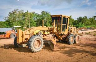 Road construction with motor grader photo