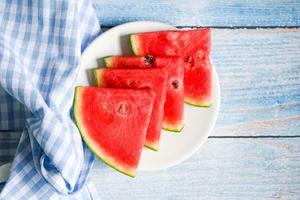 Top view watermelon slice on white plate background, Closeup sweet watermelon slices pieces fresh watermelon tropical summer fruit photo