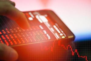 businessman use smartphone trading online forex or Stock exchange market photo