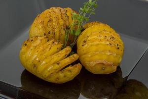 Baked potato on the plate photo