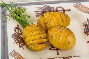 Baked potato on the plate close up view photo