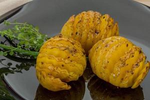 Baked potato on the plate photo