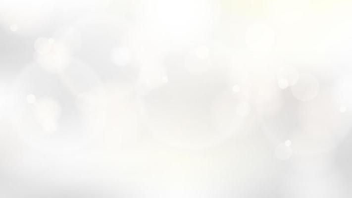 Abstract golden circles glow lights bokeh effect blurred white and grey background luxury style. Christmas winter festive backdrop