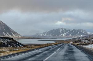 Driving through Iceland on a cold and rainy winter day, every curve in the road reveals views of epic proportions, be they mountains, fjords, or valleys. photo