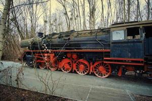 Steam locomotive parked at a terminal station. Historical railroad from 1940 photo