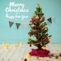 Christmas tree and flag on green background and text - Merry Christmas and Happy New Year photo
