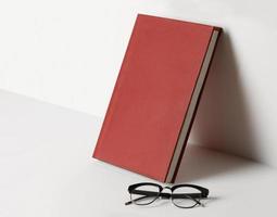 Realistic book cover mockup template with glasses photo