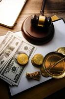 Justice and law concept.Male judge in a courtroom with the gavel, working with, computer and docking keyboard, eyeglasses, on table in morning light photo