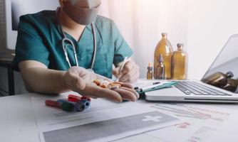 Medicine doctor and stethoscope touching icon medical network connection with modern interface on digital tablet in hospital background. Medical technology network concept photo