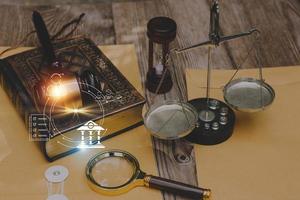 Business and lawyers discussing contract papers with brass scale on desk in office. Law, legal services, advice, justice and law concept picture with film grain effect photo