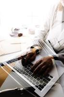 Business and lawyers discussing contract papers with brass scale on desk in office. Law, legal services, advice, justice and law concept picture with film grain effect photo