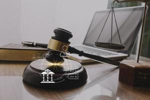 justice and law concept.Male judge in a courtroom on wooden table and Counselor or Male lawyer working in office. Legal law, advice and justice concept. photo