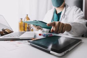 Medicine doctor and stethoscope touching icon medical network connection with modern interface on digital tablet in hospital background. Medical technology network concept photo