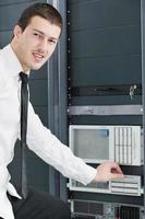 young it engeneer in datacenter server room photo