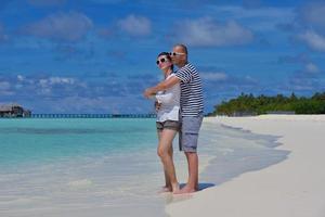 happy young  couple at summer vacation have fun and relax at beach photo