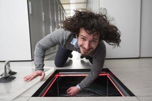 engineer connecting cables in server room photo