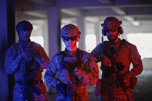 soldier squad team portrait in urban environment colored lightis photo