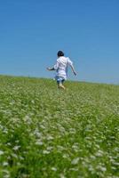 Young happy woman in green field photo