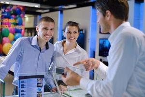 Young couple in consumer electronics store photo