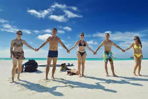 group of happy young people have fun on bach photo