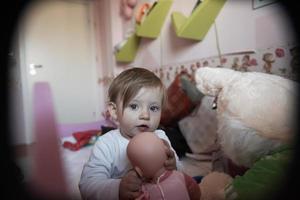 cute  little one year old baby and making first steps photo