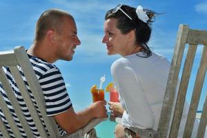 happy young couple relax and take fresh drink photo