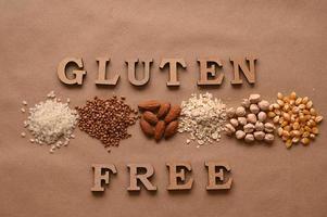 Gluten free text and gluten free products on brown background photo