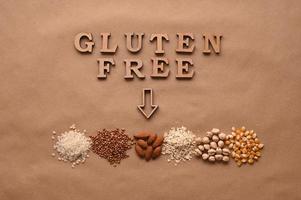 Gluten free text and gluten free products on brown background photo