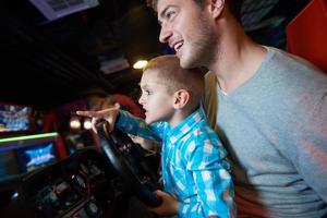 father and son playing game in playground photo